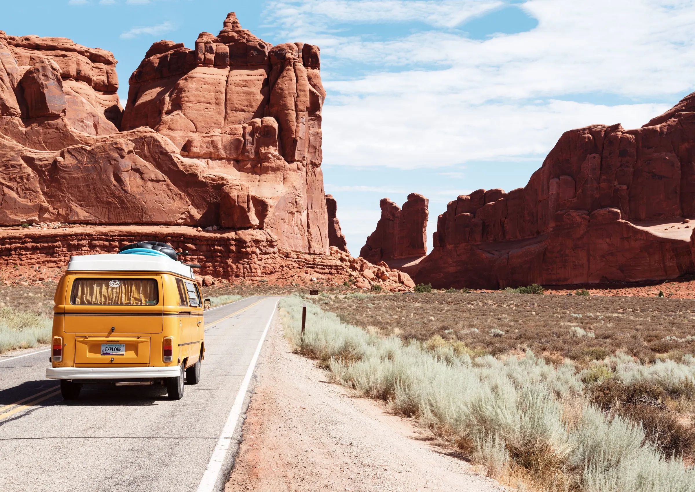 yellow car on road